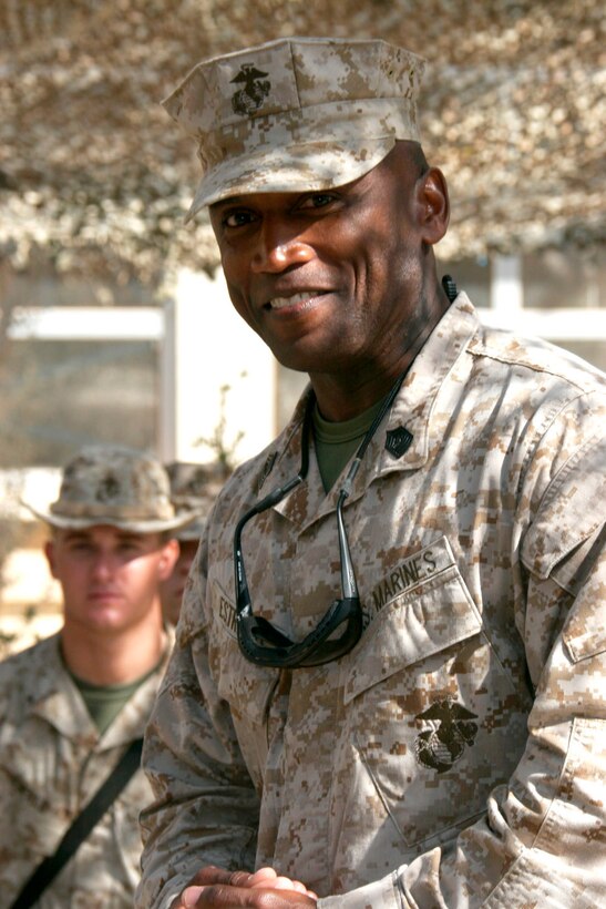 AL ASAD, Iraq ? Sergeant Maj. John L. Estrada, sergeant major of the Marine Corps, addresses Marines and sailors with Combat Logistics Battalion 2 gathered in the courtyard of the hospital here July 25.  Estrada and Gen. Michael W. Hagee, commandant of the Marine Corps, visited service members here to thank them for their accomplishments in support of Operation Iraqi Freedom.