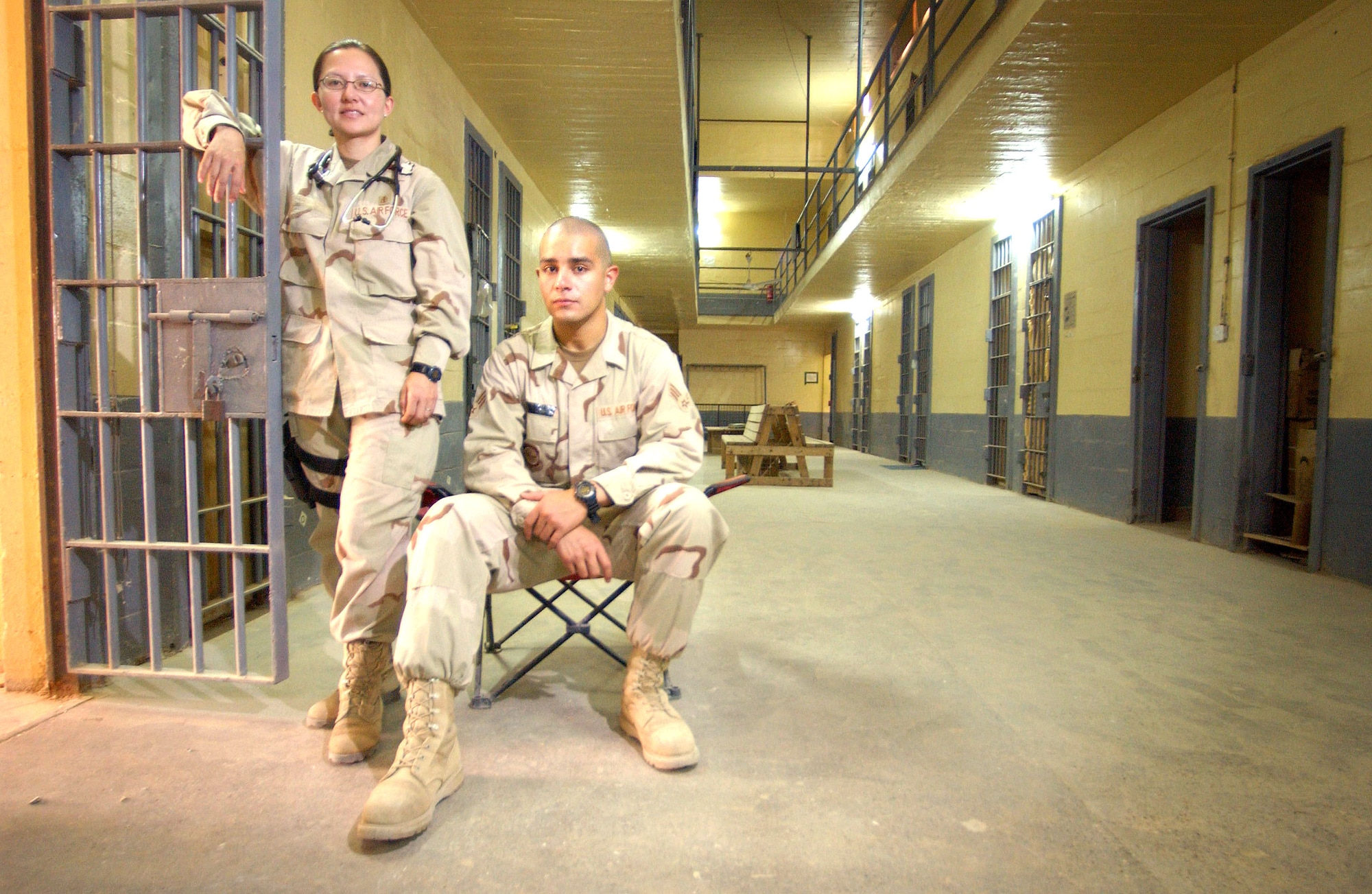ABU GHRAIB, Iraq -- Major Carol and Senior Airman Estaban, whose last names are withheld for security purposes, are part of an independent group of Air Force medics who maintain the health of detainees at Abu Ghraib prison.  The people serving at the prison live in the cell blocks that once housed victims of Saddam Hussein's regime.  (U.S. Air Force photo by Master Sgt Scott Wagers)