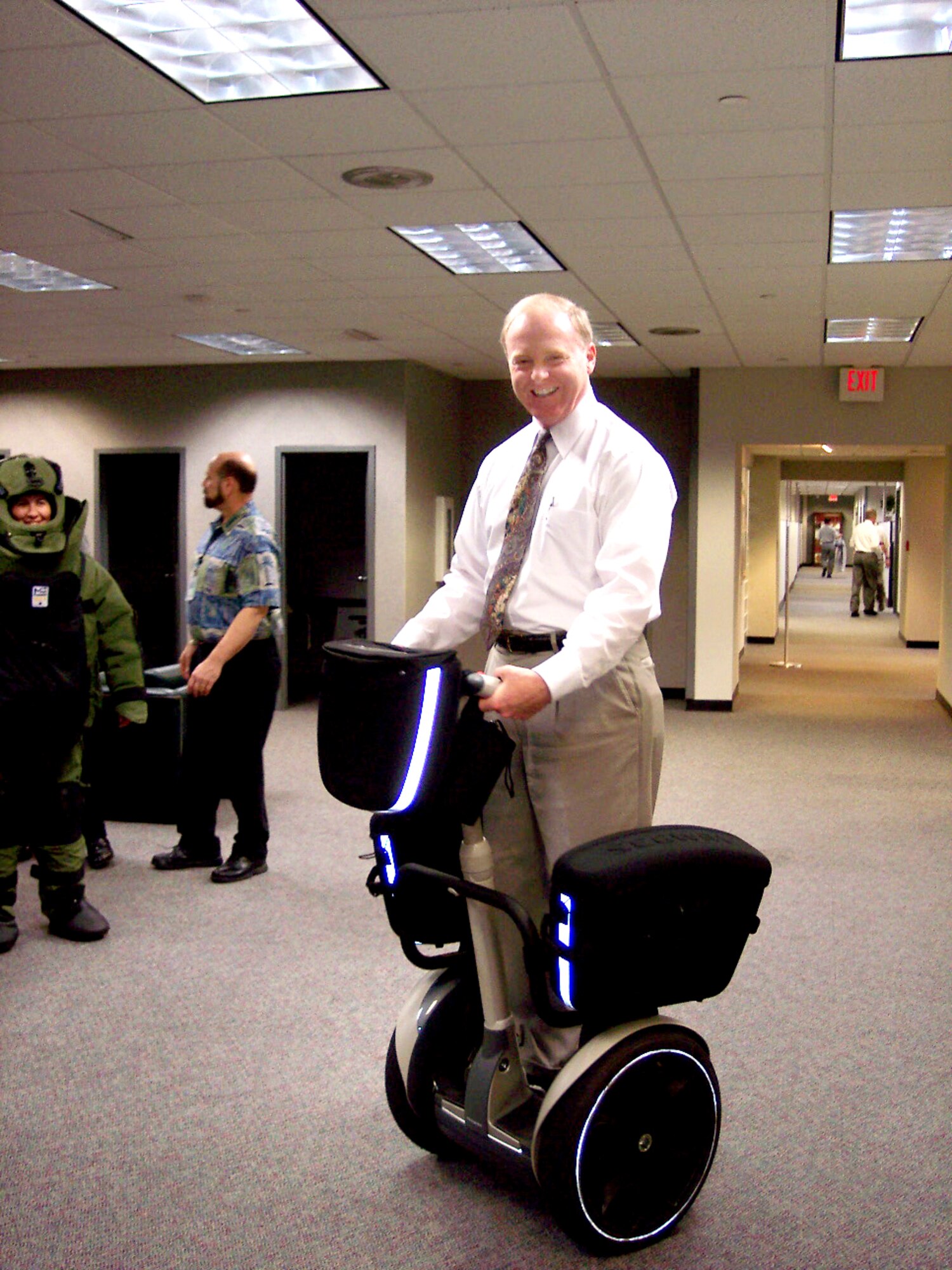 TYNDALL AIR FORCE BASE, Fla. -- Brian Lally rides a Segway used by explosive ordnance disposal teams.  He was recently selected to attend Harvard University's John F. Kennedy School of Government through an Air Force development program for senior civilian managers.  He is the executive director of the Air Force Civil Engineer Support Agency here.  (U.S. Air Force photo by Master Sgt. Michael A. Ward)
