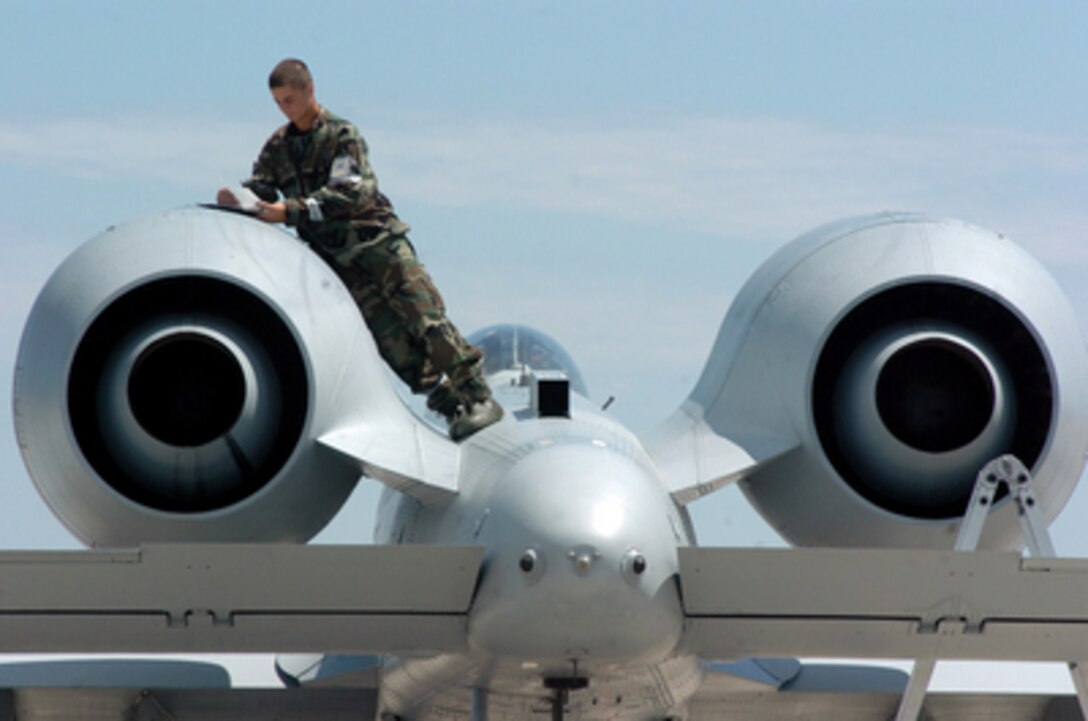 Airman 1st Class Chad Ferguson works on an engine nacelle of an A-10 Thunderbolt II as part of his maintenance work with the 110th Fighter Wing at the Alpena Combat Readiness Training Center on July 22, 2005. The 110th Fighter Wing, which is based in Battle Creek, Mich., is undergoing an Operational Readiness Inspection. 