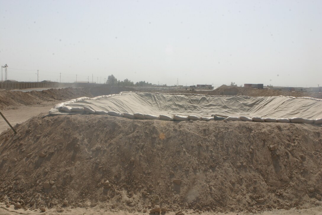CAMP FALLUJAH, Iraq – A completed fuel pit at Camp Fullejah’s fuel farm waits for use as Marines from Bulk Fuel, A Company, 6th Engineer Support Battalion, augmenting 8th ESB in direct support of Combat Logistics Bn. 8, 2nd Force Service Support Group (Forward), complete an expansion and renovation project here. (Photo by Cpl. John E. Lawson Jr.)