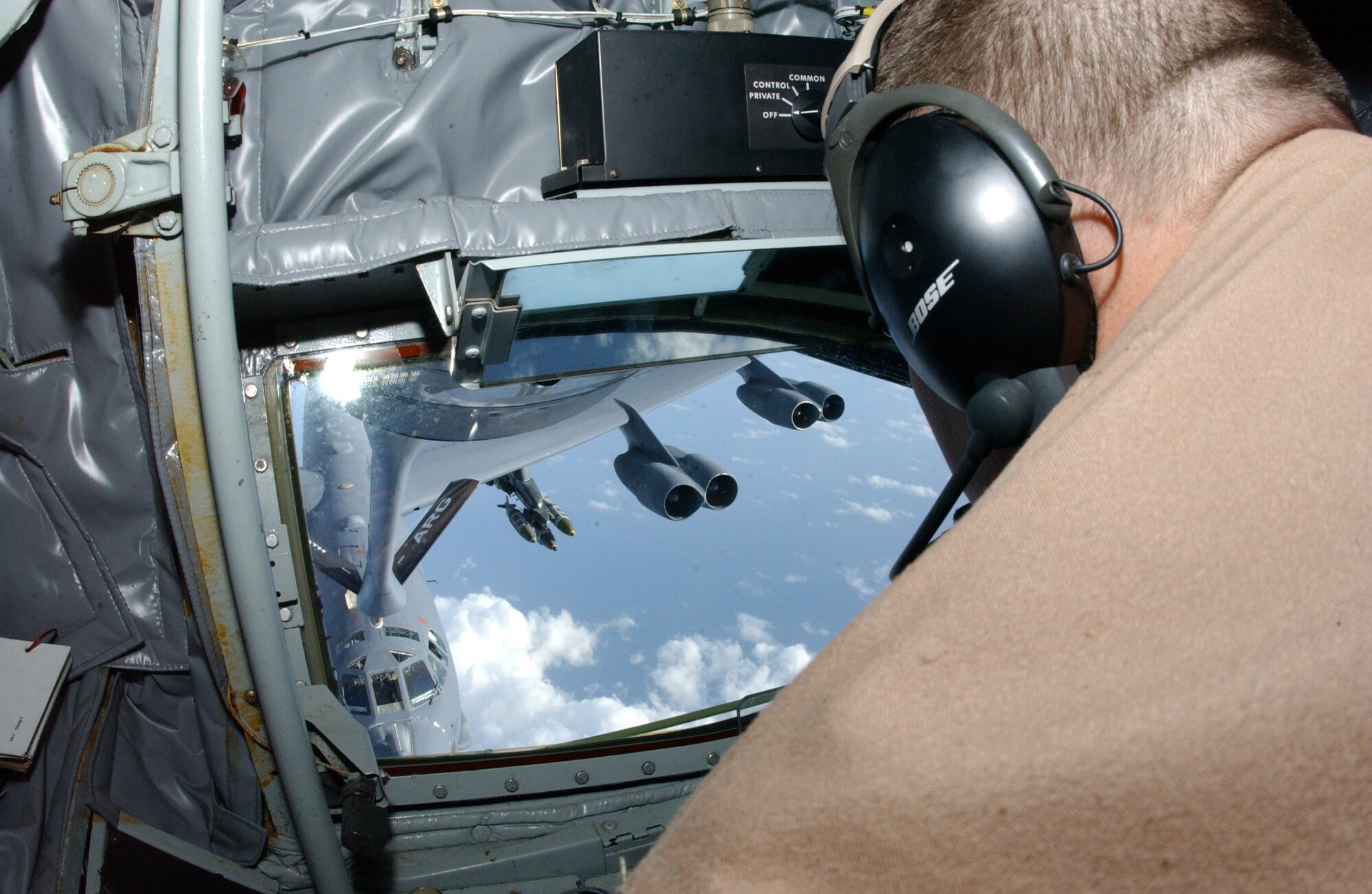 OPERATION ENDURING FREEDOM -- Senior Airman William Paull, a boom operator on a KC-135 Stratotanker, refuels a B-52 Stratofortress over a forward-deployed location July 25. Senior Airman Paull is deployed to the 28th Expeditionary Refueling Squadron from the 911th Air Refueling Squadron at Grand Forks Air Force Base, N.D. (U.S. Air Force photo by Staff Sgt. Jocelyn Rich)