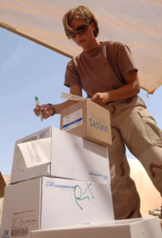 U.S. Air Force Staff Sgt. Nichole Slotness prepares medical supplies for distribution to the Air Force theater hospital at Balad Air Base, Iraq, on July 22, 2005. Slotness is deployed to the 332nd Expeditionary Medical Group from the 148th Fighter Wing in Duluth, Minn. 