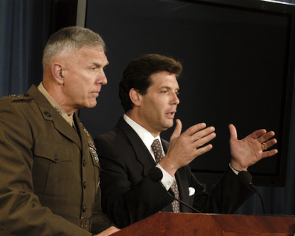 Principal Deputy Assistant Secretary of Defense for Public Affairs Lawrence Di Rita (right) responds to a reporter's question during a Pentagon press briefing on July 26, 2005. Di Rita and Joint Staff Director for Operations Lt. Gen. James T. Conway, U.S. Marine Corps, (left) conducted the briefing. 
