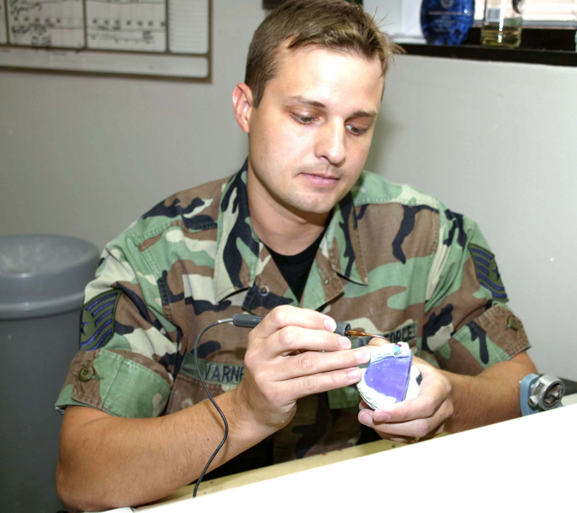 SHAW AIR FORCE BASE, S.C. -- Tech Sgt. Jerry Varner waxes a full gold crown at the dental clinic here.  He is a dental lab craftsman with the 20th Aeromedical-Dental Squadron.  (U.S. Air Force photo by Airman 1st Class Joel Mease)