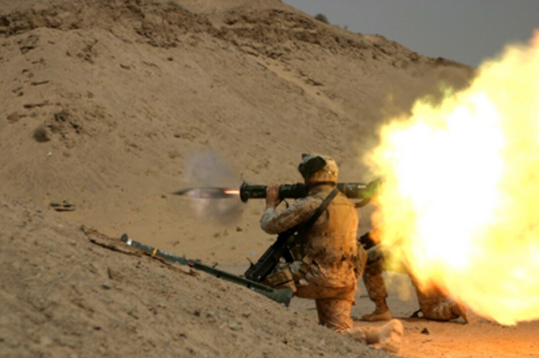 Marine Lance Cpl. Gary R. Nichols fires an AT-4 light anti-armor weapon at an old tank during fire and maneuver training near Camp Bucca, Iraq, on July 18, 2005. Nichols and his fellow Marines of the 26th Marine Expeditionary Unit (Special Operations Capable) are operating out of Camp Bucca to conduct various force protection missions. 