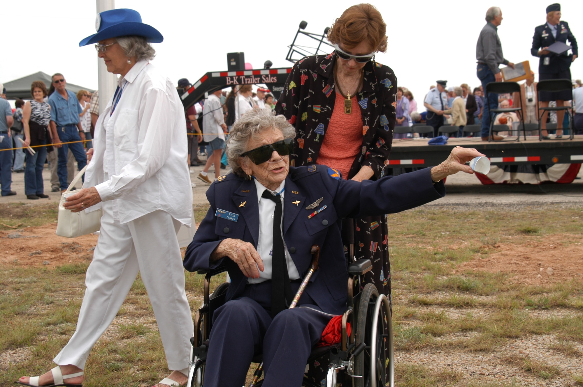 AVENGER FIELD, Texas -- Ruth Florey, one of the Women's Airforce Service Pilots, tosses seeds into the wind as part of the opening ceremonies for the National WASP World War II Museum here May 28.  The seed ceremony symbolized the planting of the traditions and heritage the women created at the museum which will grow for future generations.  (U.S. Air Force photo by Senior Airman Matthew Rosine)