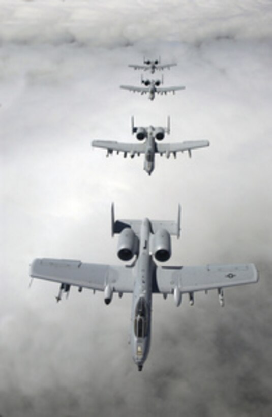 Four A-10 Thunderbolt II aircraft from the 111th Fighter Wing, Willow Grove Air Reserve Station, Pa., fly in formation after taking on fuel from a KC-10A Extender, on May 25, 2005. The Thunderbolt is designed for close air support of ground forces and can be used against all ground targets including tanks and other armored vehicles. 