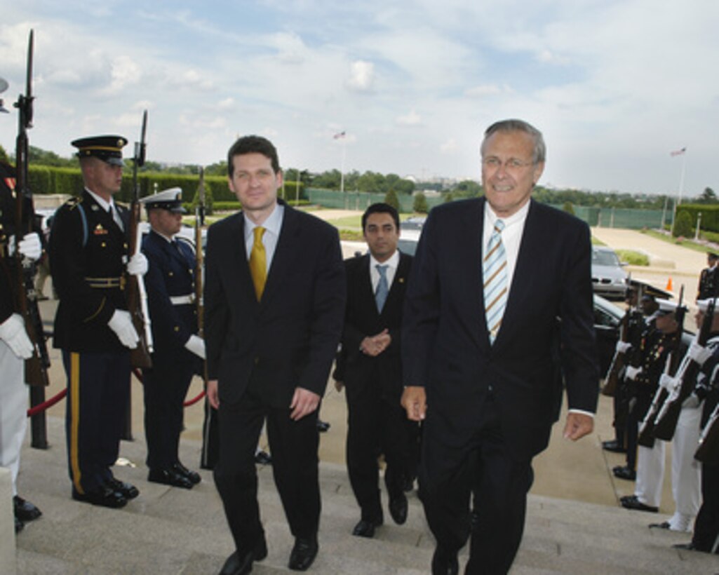 Macedonian Minister of Defense Jovan Manasievski (left) is escorted through an honor cordon and into the Pentagon by Secretary of Defense Donald H. Rumsfeld on June 1, 2005. Manasievski and Rumsfeld will meet to discuss defense issues of mutual interest. 