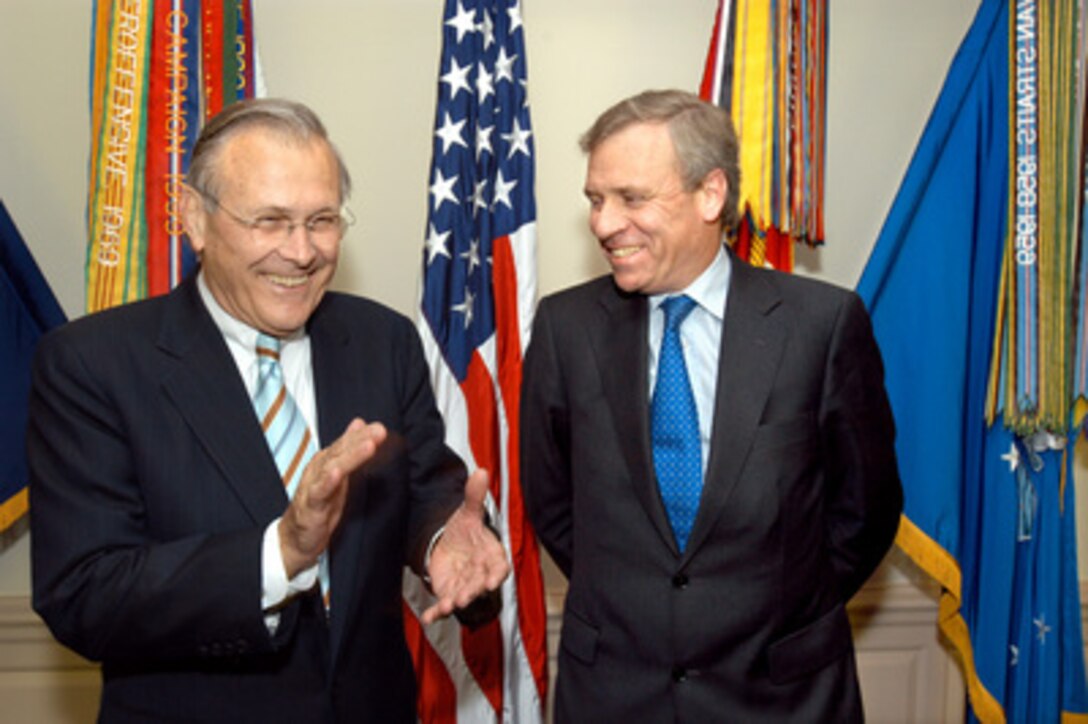 Secretary of Defense Donald H. Rumsfeld (left) shares a laugh with NATO Secretary General Jaap de Hoop Scheffer (right), of the Netherlands, before sitting down to a working lunch in the Pentagon on June 1, 2005. Rumsfeld and Scheffer will meet to discuss a broad range of international security issues relating to the Alliance. 