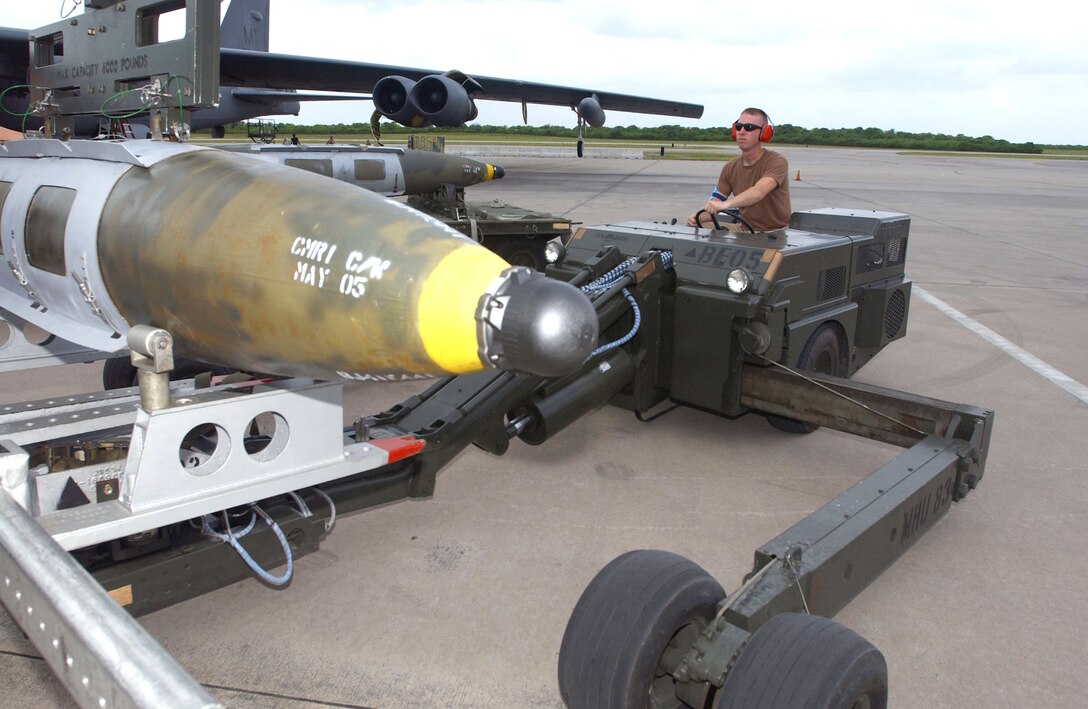 OPERATION ENDURING FREEDOM -- Airman 1st Class Marcus Thames moves a joint-direct attack munition that will be loaded on a B-52 Stratofortress.  He is a weapons loader with the 40th Expeditionary Maintenance Squadron at a forward-deployed location and is from Minot Air Force Base, N.D.  (U.S. Air Force photo by Staff Sgt. Jocelyn Rich)