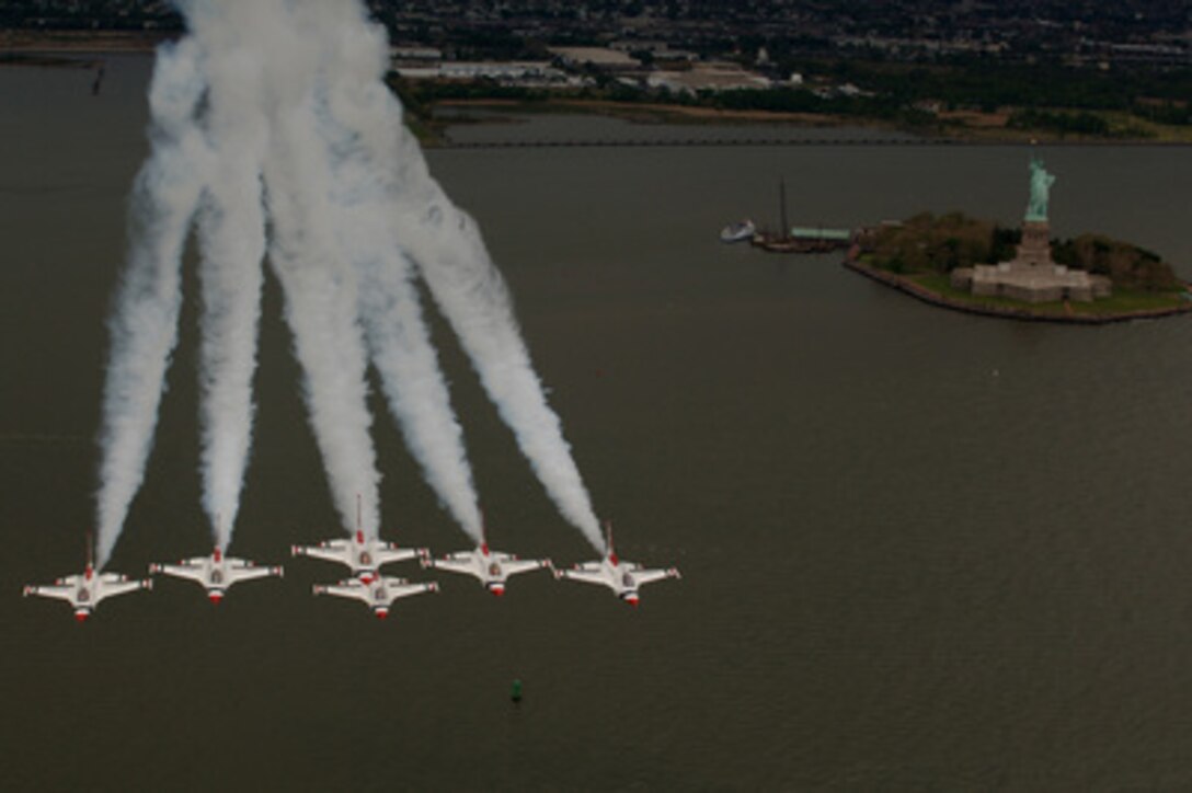 The U.S. Air Force Thunderbirds fly in formation by the Statue of Liberty in New York Harbor as they prepare for an air show at Jones Beach, N.Y., on May 26, 2005. Pilots of the Air Force's Air Demonstration Squadron perform precision aerial maneuvers to demonstrate the capabilities of their F-16 Fighting Falcons. 