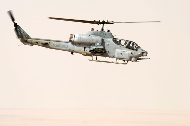 AL QAIM, Iraq ? An AH-1W Super Cobra from Marine Light/Attack Helicopter Squadron 269, Detachment Al Qaim flies over the desert during a training flight June 4.  The Marines in the detachment have been training as much as they can to get new qualifications or maintain their current qualifications whenever they?re not conducting operations that have a direct impact on the Global War on Terrorism.