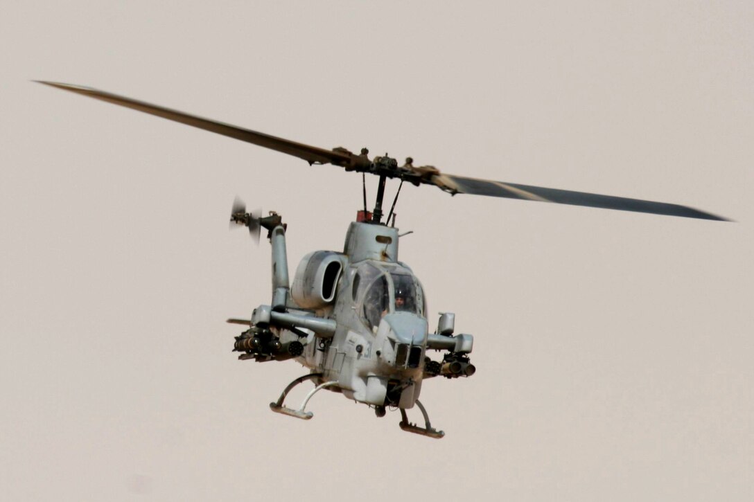 AL QAIM, Iraq ? An AH-1W Super Cobra from Marine Light/Attack Helicopter Squadron 269, Detachment Al Qaim flies over the desert during a training flight June 4.  The Marines in the detachment have been busy supporting Operation Iraqi Freedom and training as much as they can to get new qualifications or maintain their current qualifications.