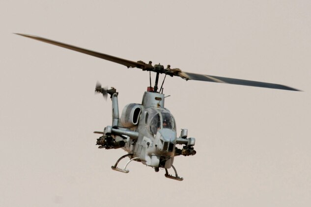 AL QAIM, Iraq ? An AH-1W Super Cobra from Marine Light/Attack Helicopter Squadron 269, Detachment Al Qaim flies over the desert during a training flight June 4.  The Marines in the detachment have been busy supporting Operation Iraqi Freedom and training as much as they can to get new qualifications or maintain their current qualifications.