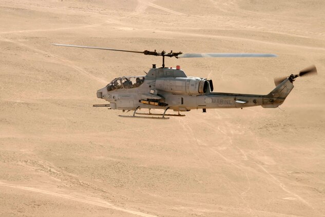 AL QAIM, Iraq ? An AH-1W Super Cobra from Marine Light/Attack Helicopter Squadron 269, Detachment Al Qaim flies over the desert during a training flight June 4.  The Marines in the detachment have been training as much as they can to get new qualifications or maintain their current qualifications whenever they?re not conducting operations that have a direct impact on the Global War on Terrorism.