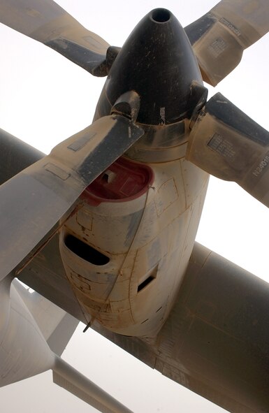 BAGHDAD, Iraq -- A C-130 Hercules sits grounded because of poor visibility from an overnight sandstorm that brought 40 mph winds and a blanket of dust here recently.  The C-130 is assigned to the 910th Airlift Wing in Youngstown, Ohio.  (U.S. Air Force photo by Tech. Sgt. Brian Davidson)          