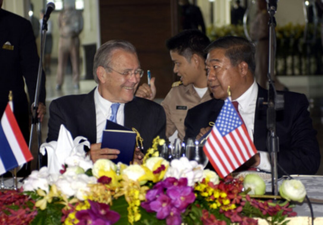 Secretary of Defense Donald H. Rumsfeld talks with Thailand's Minister of Defense Gen. Thammarat Isarangura during a luncheon held in his honor at the Royal Thai Navy Institute in Bangkok, Thailand, on June 6, 2005. Rumsfeld is in Thailand to strengthen U.S.-Thai relationships following a three-day International Institute for Strategic Studies Asia Security Conference in Singapore. 