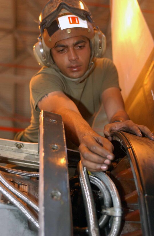 AL QAIM, Iraq ? 1st Lt. William Wallace, a UH-1N Huey pilot with Marine Light/Attack Helicopter Squadron 269, Detachment Al Qaim inspects the helicopter?s engine compartment during a preflight inspection June 7.  Wallace, from La Grange, Ky., recently took part in a seven-day offensive aimed at eliminating insurgents and foreign fighters from the northwestern Al Anbar province.