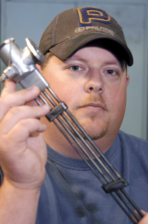 TINKER AIR FORCE BASE, Okla. -- Kent Johnson's simple solution cleaned the thin tubes of an aircraft engine's augmenter fuel nozzle, saving the Air Force big money and earning him a $10,000 award through the Innovative Development through Employee Awareness program.  He is a pneudrolics mechanic with Oklahoma City Air Logistics Center's fuel accessories shop here.  (U.S. Air Force photo by Margo Wright)