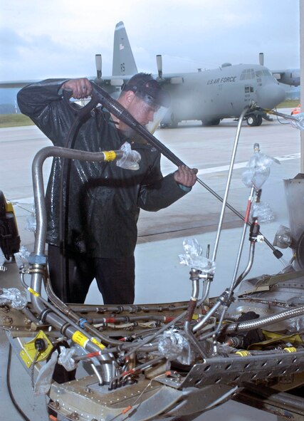 RAMSTEIN AIR BASE, Germany -- Senior Airman Tyler Kehm uses high-pressure water spray to clean a section of a C-130 Hercules engine.  The 86th Maintenance Squadron's propulsion flight here is the focal point for any C-130 engines needing repairs in Europe or those deployed supporting operations Iraqi Freedom and Enduring Freedom.  (U.S. Air Force photo by Master Sgt. John E. Lasky)