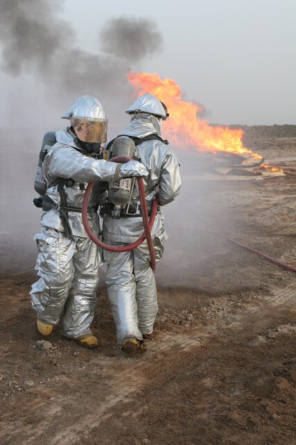 AL ASAD, Iraq (June 9, 2005) - Marines from Marine Wing Support Squadron 271 move a 300,000 pound non-traditional field expedient bridge into place. The bridge is part of project to enhance the security of the airbase.