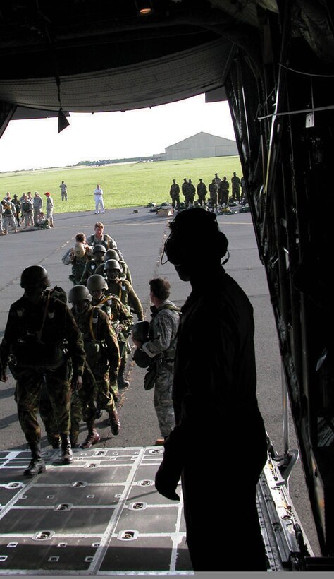 KENYA -- Kenyan and American paratroopers board a C-130 Hercules en route to a drop zone June 6.  More than 140 paratroopers left the Kenyan army base landing strip and made successful jumps during the three-day, 14-drop mission.  (U.S. Air Force photo by Tech. Sgt. Mark Munsey)