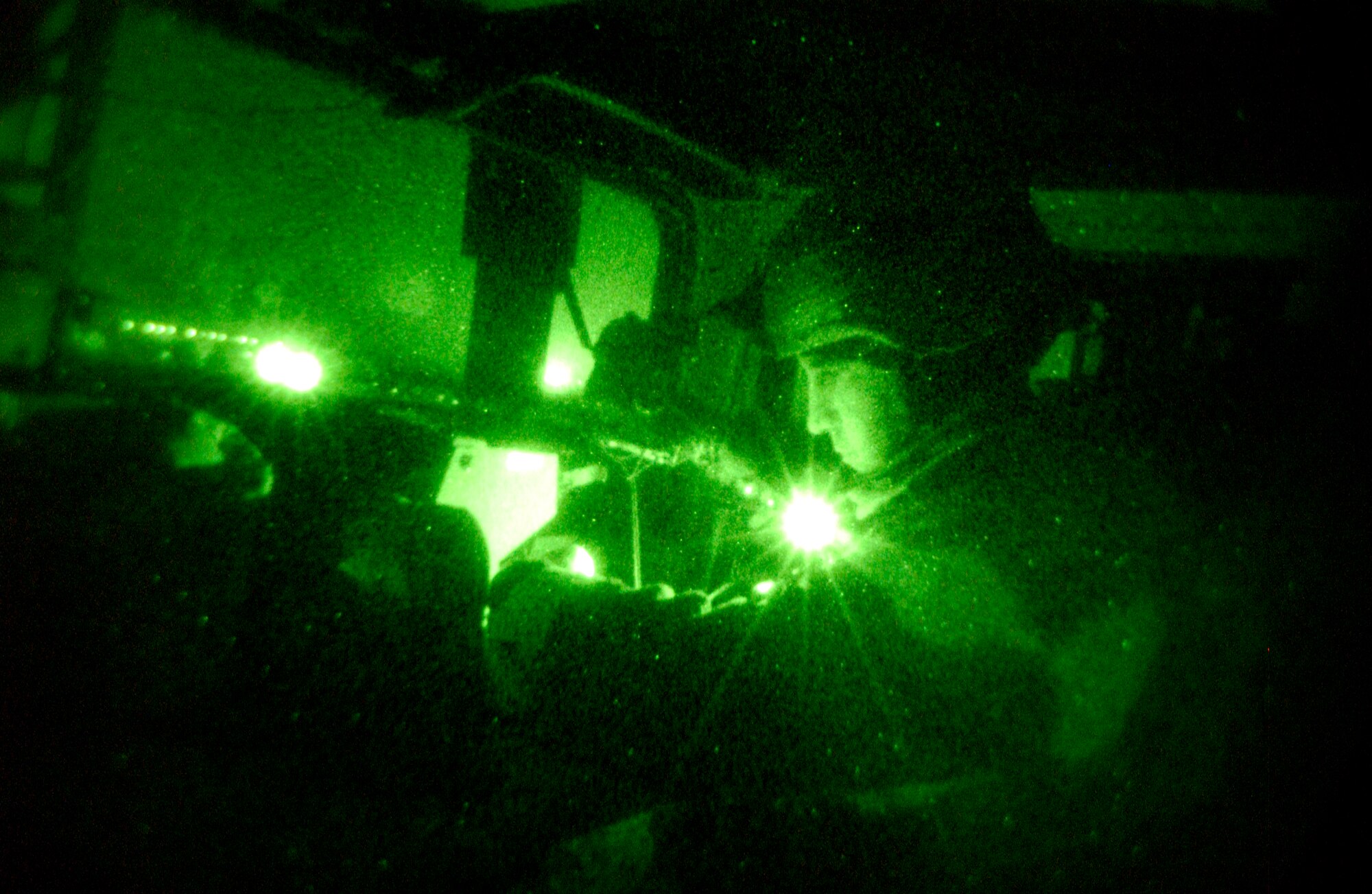 IRAQ -- Staff Sgt. Jason Seaborn references a map during a nighttime patrol near Kirkuk Air Base.  Security forces Airmen make nightly trips off base to ensure security of base people.  He is assigned to the 506th Expeditionary Security Forces Squadron.  (U.S. Air Force photo by Tech. Sgt. Christopher Gish)