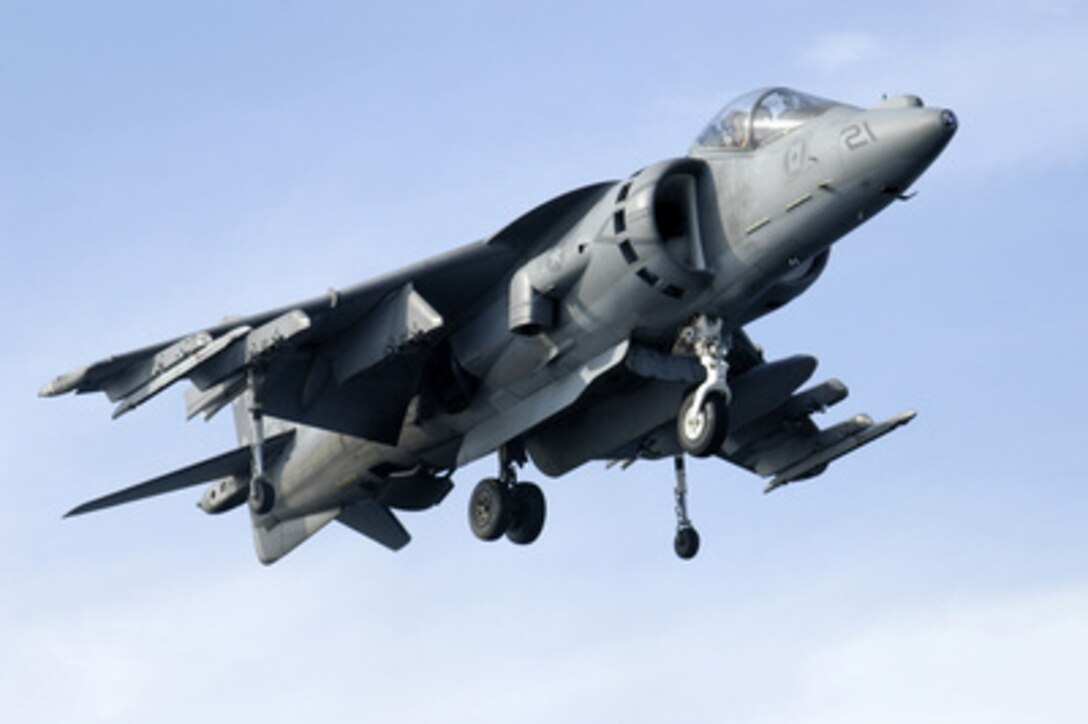 An AV-8B Harrier hovers above the flight deck of the USS Bataan (LHD 5) before landing on June 9, 2005. The Bataan is underway in the Atlantic Ocean as tests of the V-22 Osprey are being conducted. 