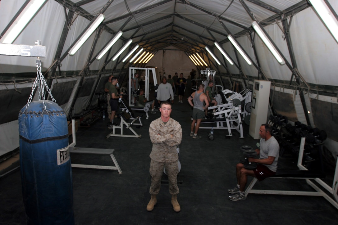 AL ASAD, Iraq - Corporal Ryan Walters, embarkation noncommissioned officer with Marine All-Weather Fighter Attack Squadron 224 and Parkerburg, W.V., stands in the middle of the Southside Gym here June 12. Walters, along with his fellow embark and supply Marines worked with the two other units on the ?southside? of the base to organize the gym to allow all of the Marines in the three squadrons a gym that is close by so they don?t need to find a way to the mainside gym.