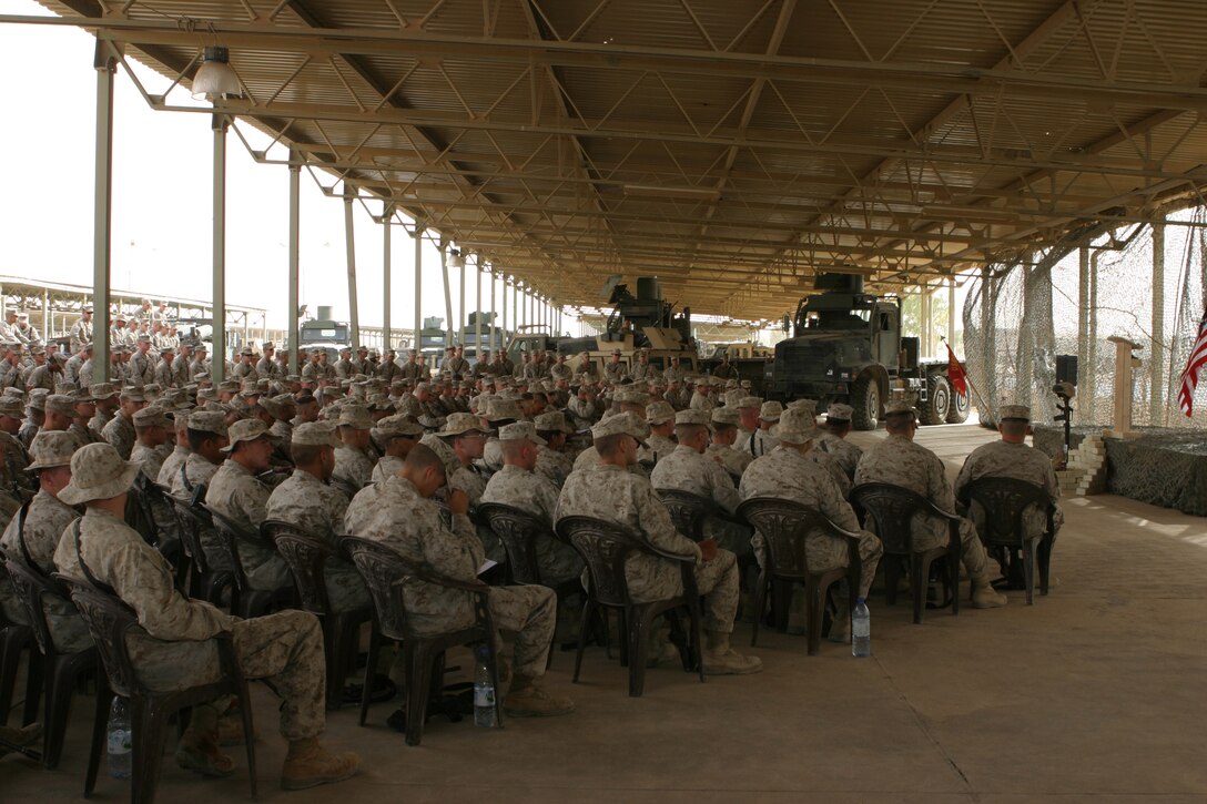 AL ASAD, Iraq (June 14, 2005) - Service members with Combat Logistics Battalion 2, gathered together June 12 to honor the life of Lance Cpl. Marc L. Tucker, a motor transportation operator augmented as a military policeman, Military Police Detachment, CLB-2, 2d Force Service Support Group (Forward).  Tucker, a Pontotoc, Miss., native, was attached to 4th Squad, MP Detachment, and deployed to Iraq to provide security for the explosive ordnance disposal team, recovery missions, engineer crater repair missions and convoys. He lost his life while supporting Operation Iraqi Freedom 04-06. During the memorial service, Tucker's friends talked about how he influenced and touched each one of their lives. They talked about the funny memories and what they are going to miss.  Most of the Marines spoke of the great amount of respect and love they have for their "brother."