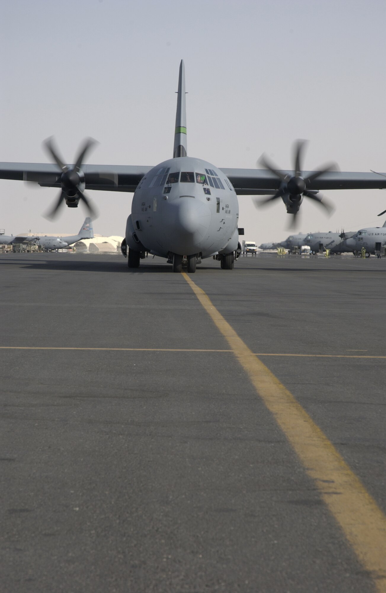 SOUTHWEST ASIA -- A stretch version C-130J Hercules from the California Air National Guard's 146th Airlift Squadron taxis on a ramp at a forward-deployed location here while supporting missions in Iraq, Afghanistan and the Horn of Africa.  The J-model is the latest upgrade to the C-130 cargo plane series.  (U.S. Air Force photo by Tech. Sgt. Randy Mallard)