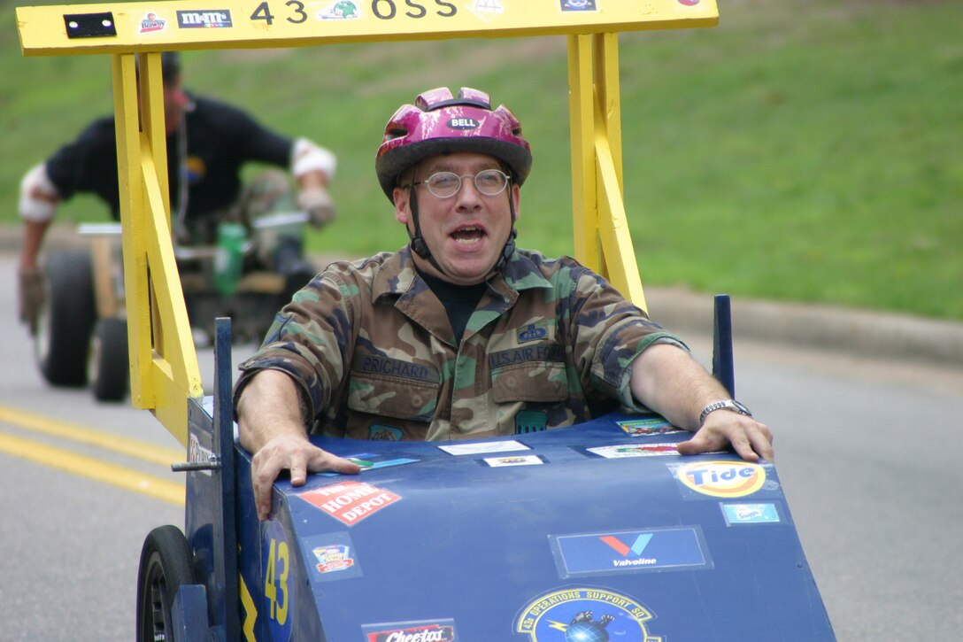 POPE AIR FORCE BASE, N.C. -- Master Sgt. Ted Prichard tries to keep his car steady at the Pope Box Derby here recently.  He is assigned to the 43rd Operations Support Squadron.  (U.S. Air Force photo by Lisa Terry McKeown)