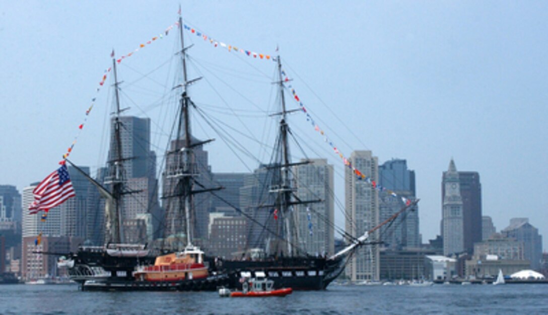 Tugs and U.S. Coast Guard boats escort the USS Constitution to Castle Hill Island in South Boston, Mass., in preparation for a 21-gun salute on June 11, 2005. The wooden hulled, three-masted frigate "Old Ironsides" is the oldest commissioned ship in the U.S. Navy and the world's oldest commissioned warship afloat. 