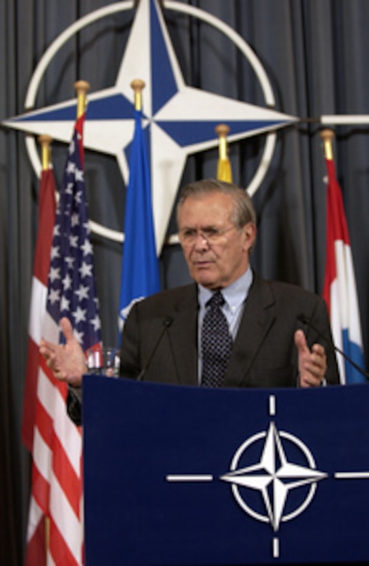 Secretary of Defense Donald H. Rumsfeld responds to question from a journalist during a press conference following a North Atlantic Council meeting at the NATO conference in Brussels, Belgium, on June 9, 2005. Rumsfeld is in Belgium to attend the NATO conference and meet with his counterparts. 