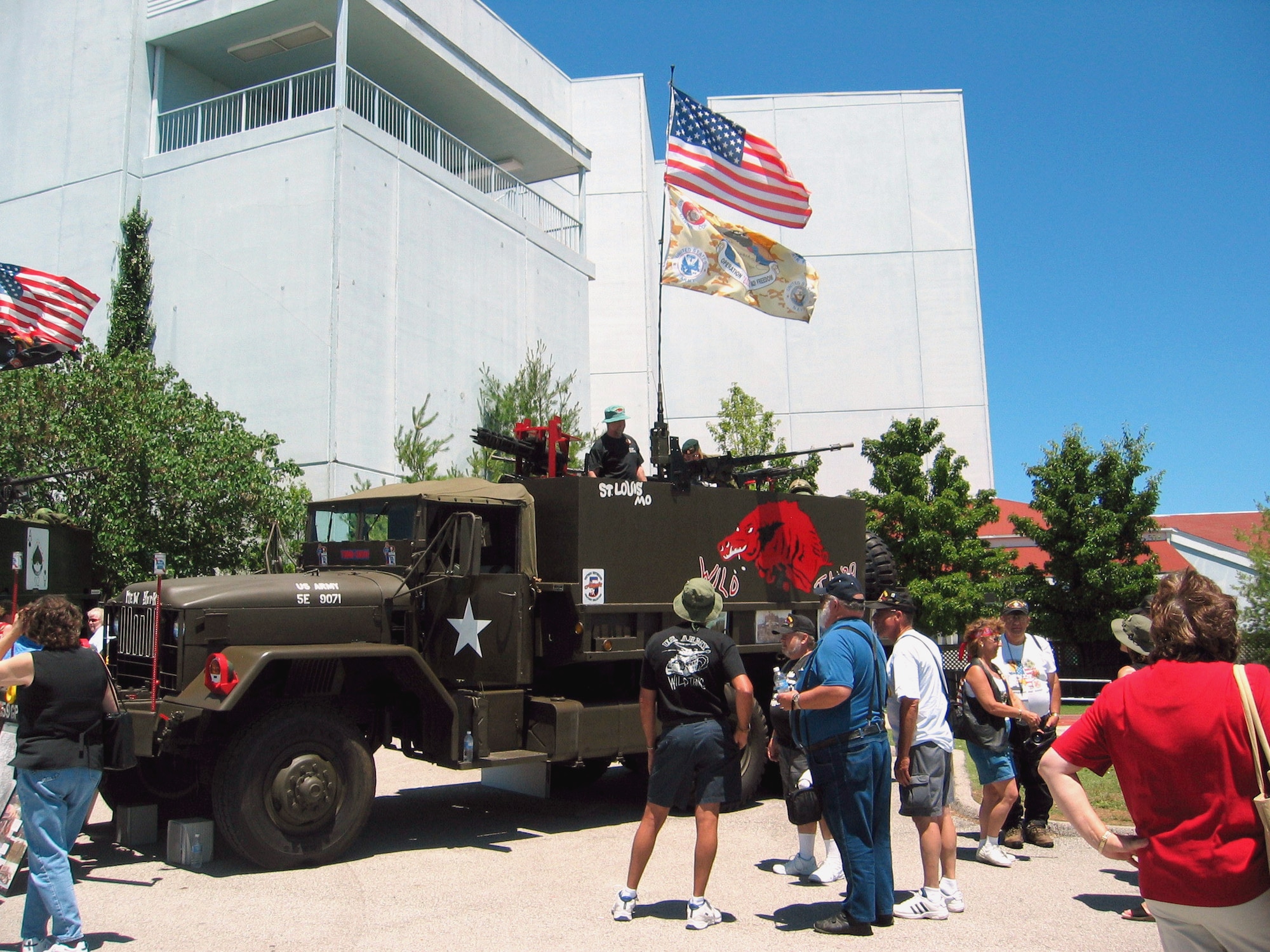 BRANSON, Mo. -- Vietnam veterans crowd around a display of military vehicles during Operation Homecoming USA here.  The weeklong homecoming was planned as a belated homecoming celebration for veterans.  (Department of Defense photo by Donna Miles)