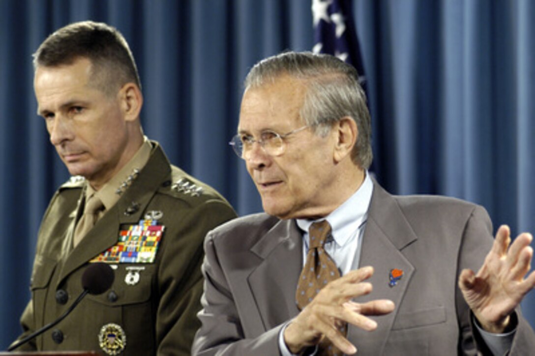 Secretary of Defense Donald H. Rumsfeld (right) talks about the importance of the detention facility at Guantanamo, Cuba, to the Global War on Terrorism during a Pentagon press briefing on June 14, 2005. Rumsfeld and Vice Chairman of the Joint Chiefs of Staff Gen. Peter Pace, U.S. Marine Corps, conducted the briefing. 
