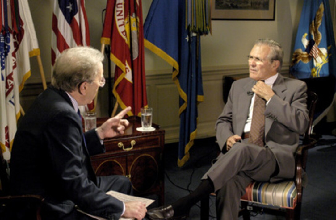 British television journalist Sir David Frost (left) interviews Secretary of Defense Donald H. Rumsfeld (right) in the Pentagon on June 13, 2005. Frost conducted an on-camera interview with Rumsfeld for the BBC. 