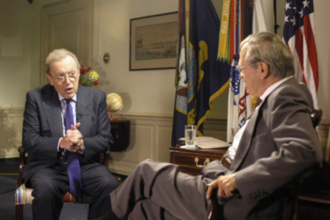 Sir David Frost (left) conducts an on-camera interview for the BBC with Secretary of Defense Donald H. Rumsfeld (right) in the Pentagon on June 14, 2005. 