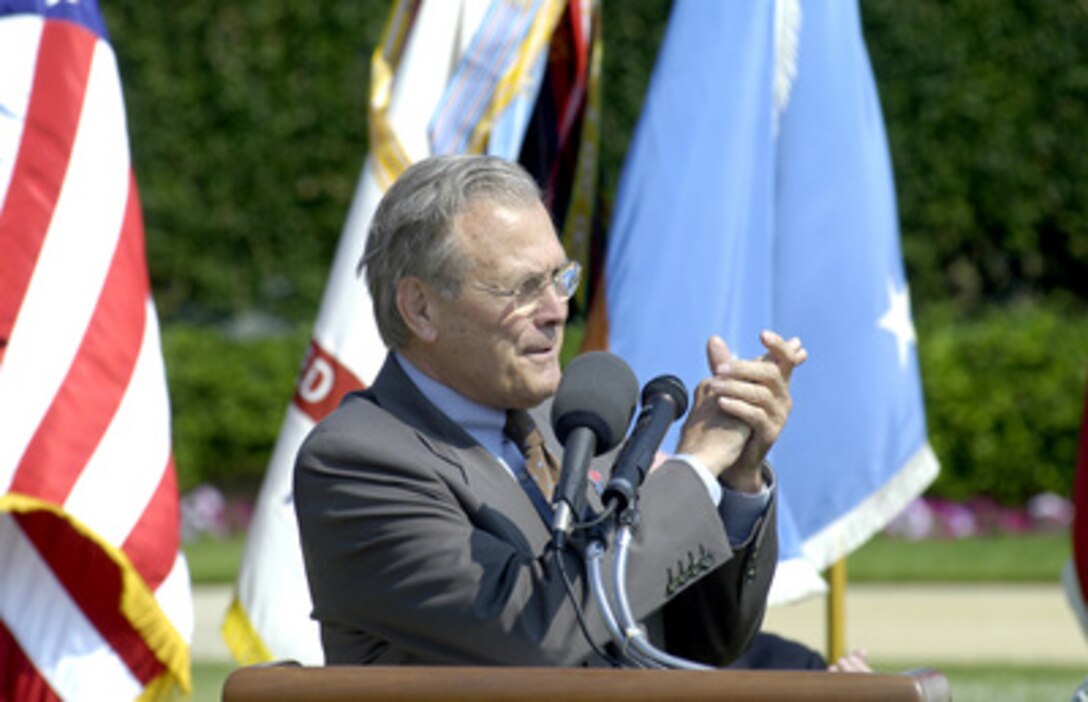 Secretary of Defense Donald H. Rumsfeld applauds Army veterans of earlier wars during his address at Pentagon ceremonies marking the 230th anniversary of the founding of the U.S. Army on June 14, 2005. 