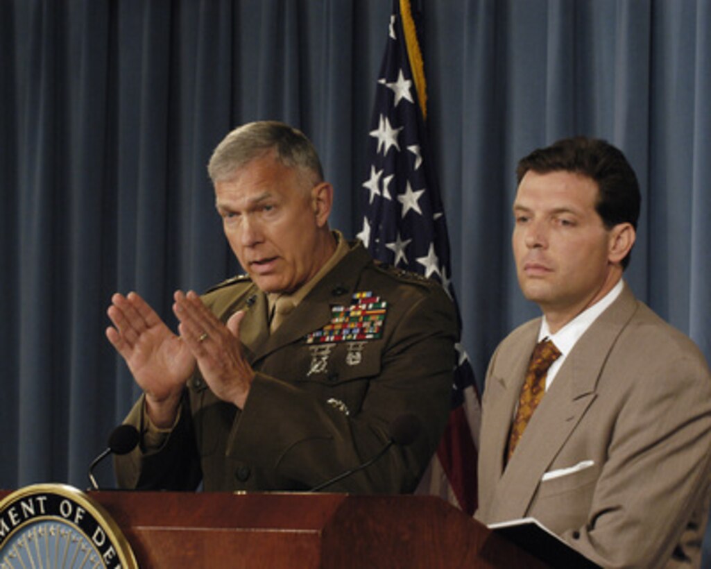 Joint Staff Director for Operations Lt. Gen. James T. Conway, U.S. Marine Corps, responds to a reporter's question during a Pentagon press briefing on June 16, 2005. Conway and Principal Deputy Assistant Secretary of Defense for Public Affairs Lawrence Di Rita (right) conducted the briefing. 