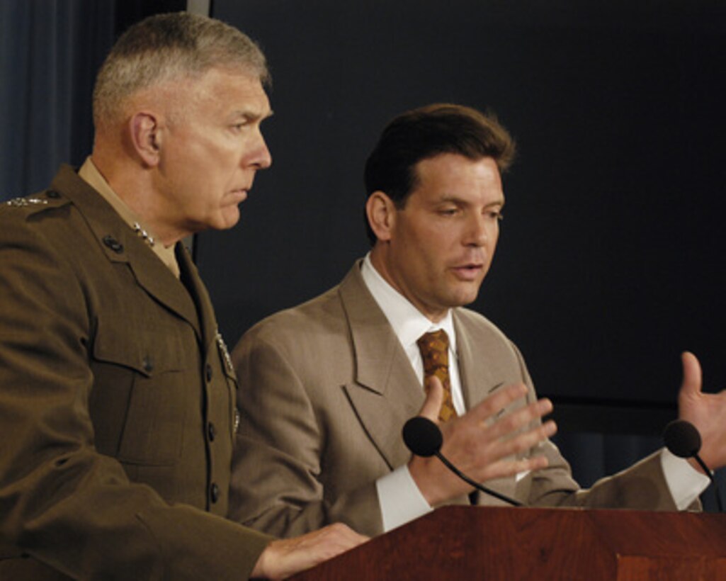 Principal Deputy Assistant Secretary of Defense for Public Affairs Lawrence Di Rita (right) responds to a reporter's question during a Pentagon press briefing on June 16, 2005. Di Rita and Joint Staff Director for Operations Lt. Gen. James T. Conway, U.S. Marine Corps, (left) conducted the briefing. 