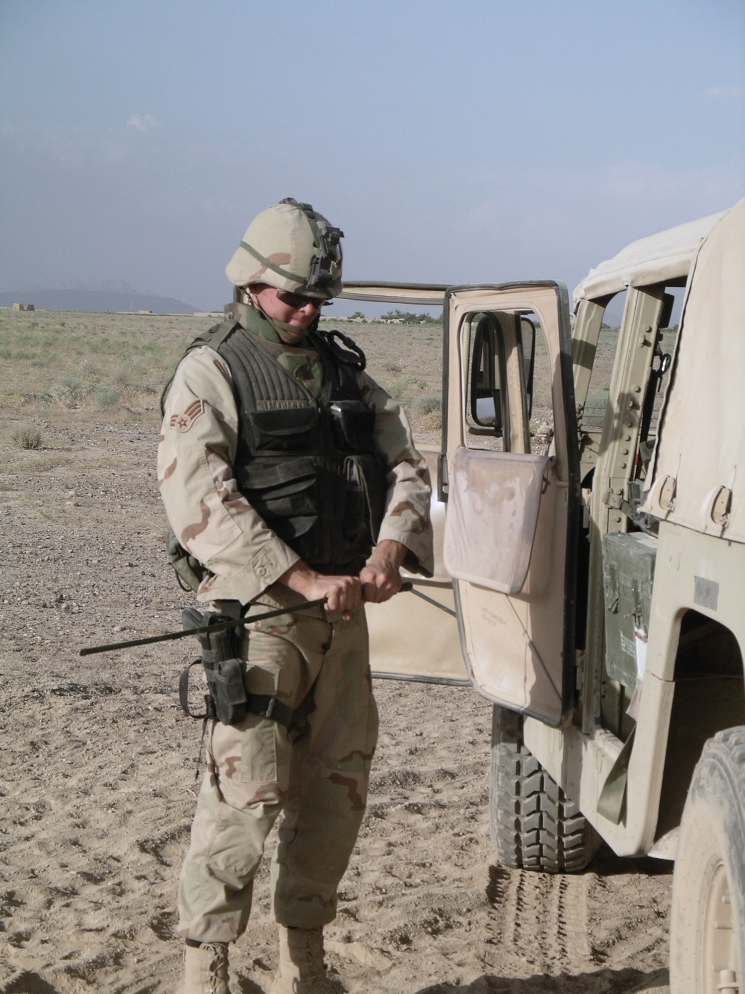 KANDAHAR AIRFIELD, Afghanistan -- Senior Airman David Gerig assembles a remote fire device before a controlled detonation here.  He is assigned to the 451st Air Expeditionary Group's explosive ordnance disposal flight and is deployed from Kadena Air Base, Japan.  (U.S. Air Force photo by Master Sgt. Jim Skyberg)

