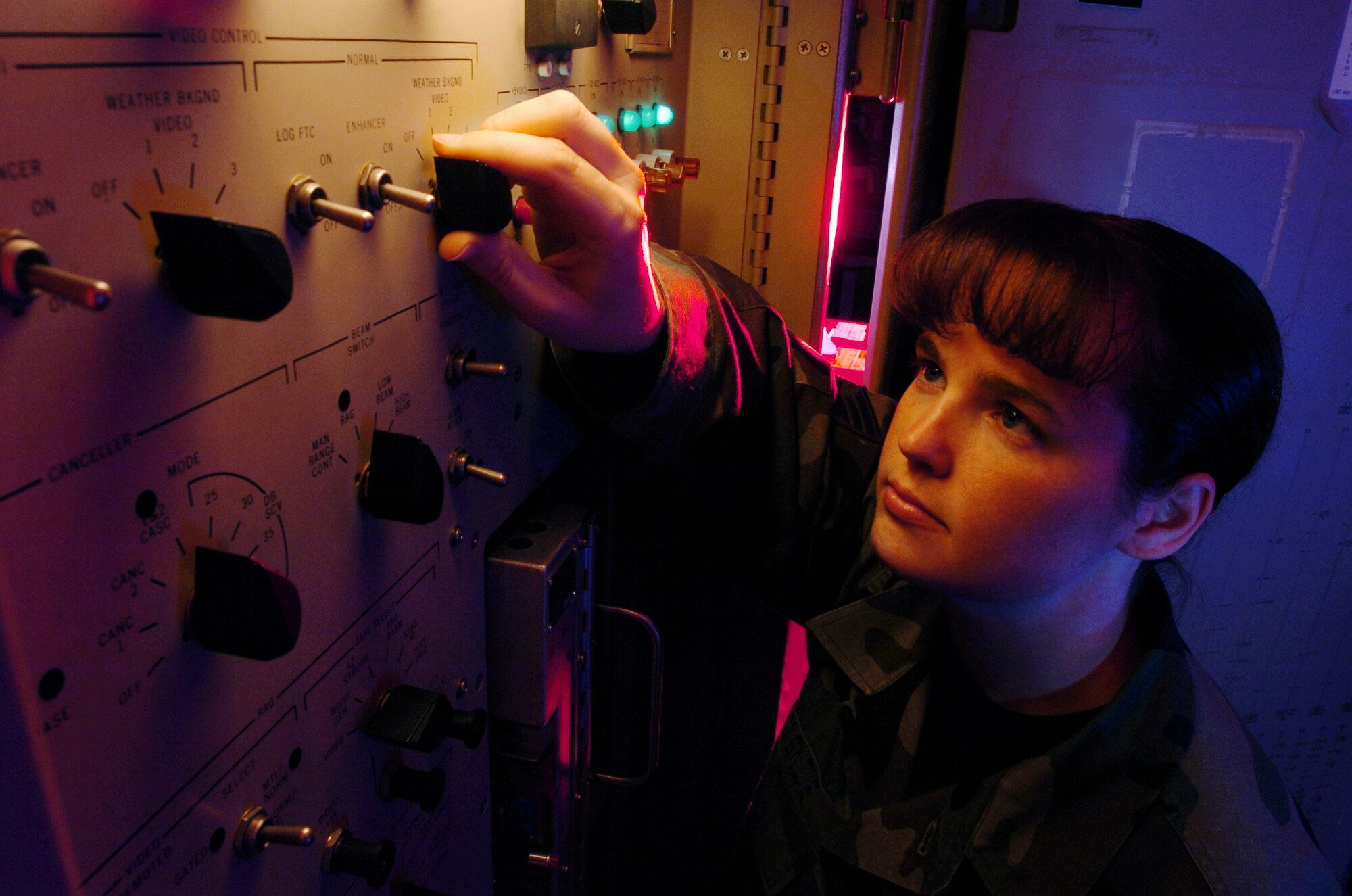 YOKOTA AIR BASE, Japan -- Staff Sgt. Kelly McKenzie sets up processor equipment for the airport surveillance radar during a preventive maintenance inspection here.  Radar technicians install, maintain, overhaul and repair ground aircraft control and warning systems used to guide incoming and outgoing aircraft here.  She is assigned to the 374th Communications Squadron.  (U.S. Air Force photo by Master Sgt. Val Gempis) 