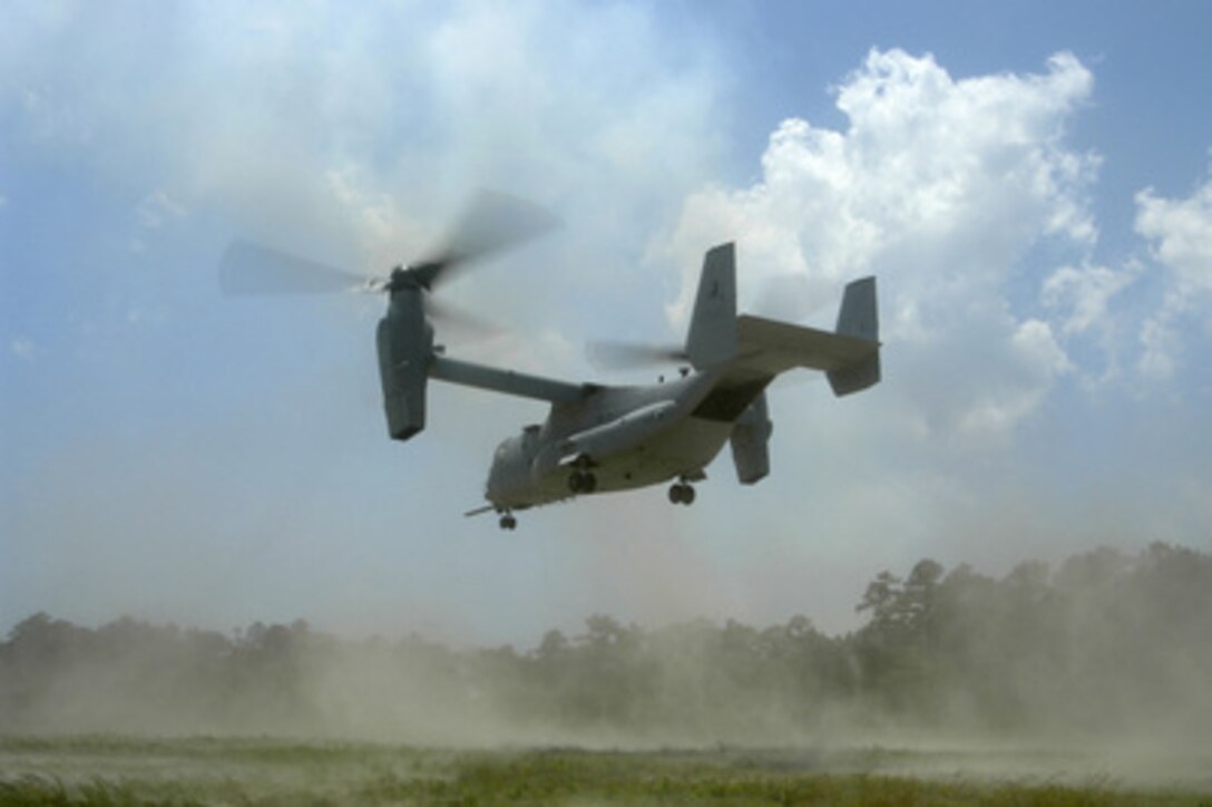 An MV-22 Osprey makes a tactical landing to offload Marines at Raven landing zone in Camp Lejeune Marine Base, N.C., on June 16, 2005. The Marines are attached to 1st Battalion, 8th Marine Regiment embarked onboard amphibious assault ship USS Bataan (LHD 5). The Osprey is assigned to Marine Tiltrotor Operational Test and Evaluation Squadron 22. 