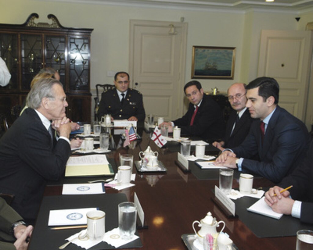 Georgian Minister of Defense Irakli Okruashvili (right) meets with Secretary of Defense Donald H. Rumsfeld (left) in the Pentagon on June 17, 2005. Okruashvili and Rumsfeld are meeting to discuss defense issues of mutual interest. From left to right are Rumsfeld, Georgian Defense Attaché Major Lasha Beridze, Georgian Deputy Chairman Parliamentary Committee for Defense and Security Nika Rurua, Georgian Ambassador to the U.S. Levon Mikeladze and Okruashvili. 