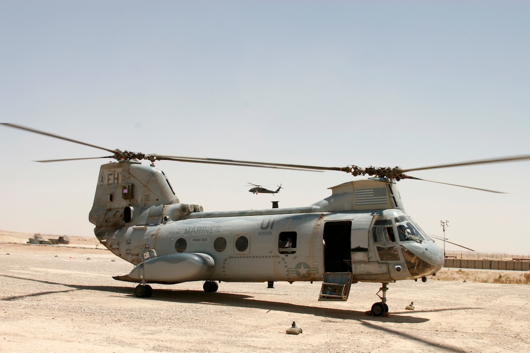 AL QAIM, Iraq ? A CH-46E Sea Knight from Marine Medium Helicopter Squadron 264 starts turning its rotors in preparation to taking off on a mission June 18.  The ?Black Knights? of HMM-264 have a detachment of Marines and aircraft conducting casualty evacuation missions during Operation Spear.