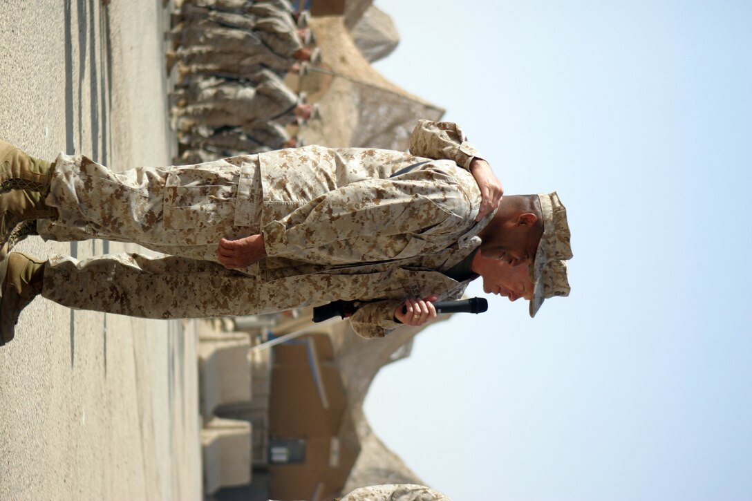CAMP TAQADDUM, Iraq -- Lietenant Gen. James F. Amos, commanding general of II Marine Expeditionary Force, talks about Brig. Gen. Ronald S. Coleman, a Darby, Pa., native, after Coleman relinquished command of 2d Force Service Support Group to Brig. Gen. John E. Wissler.  “Ron, you’ve done a great job of leading these Marines,” said Amos. “If anyone thinks it was an easy decision for Ron to let his Marines come out here without him; it wasn’t. But knowing they were coming over here with Brigadier General Wissler made it easier for him. He wanted to come out here to do this because he understands the sacrifice.”