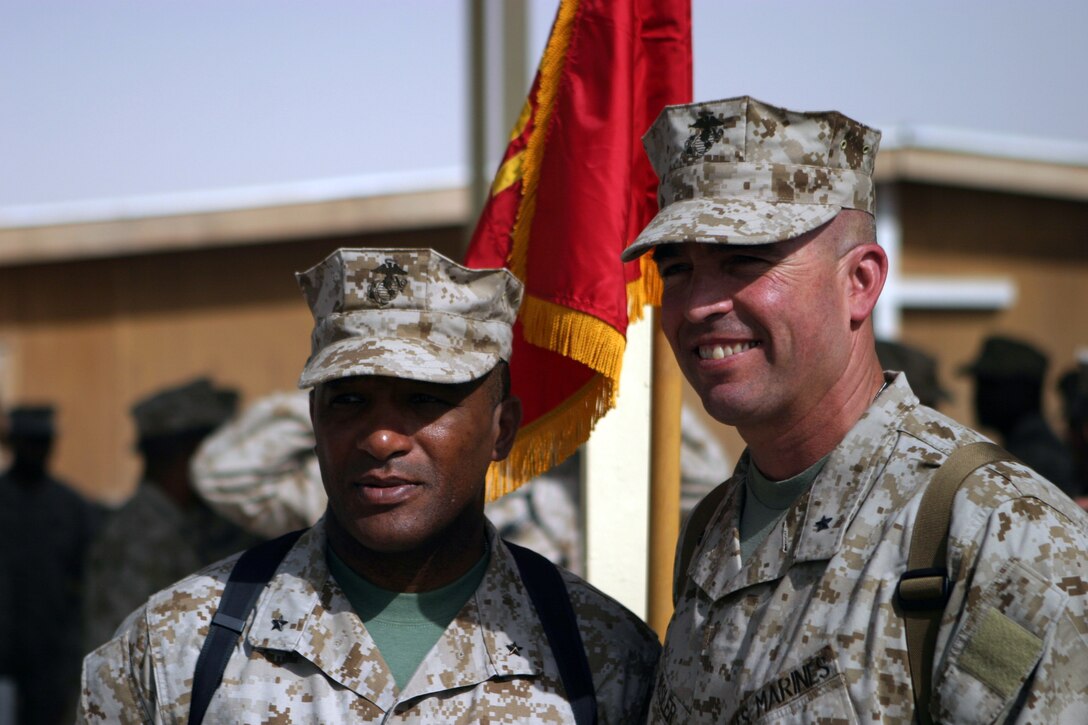 CAMP TAQADDUM, Iraq - – Brigadier Gen. John E. Wissler, a Brooklyn Park, Minn., native (right), assumed command of 2d Force Service Support Group from Brig. Gen. Ronald S. Coleman, a native of Darby, Pa., in a ceremony here June 19. The generals pose for a photo after the ceremony.