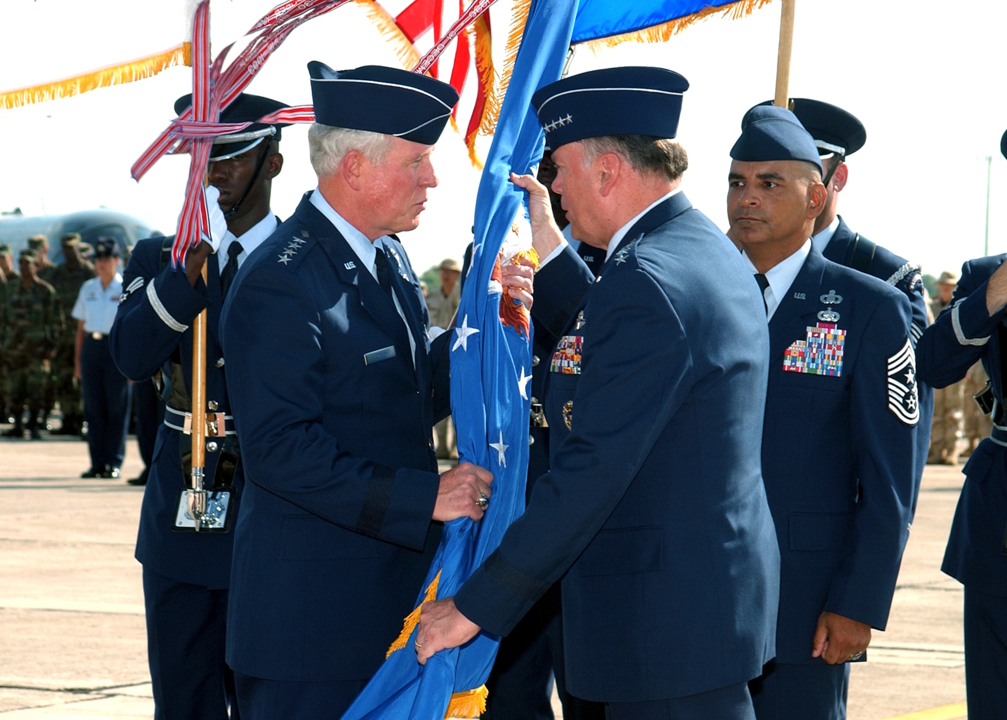 RANDOLPH AIR FORCE BASE, Texas -- Gen. William R. Looney III accepts command of Air Education and Training Command from Air Force Chief of Staff Gen. John P. Jumper here June 17.  More than 1,200 people attended the change of command ceremony.  (U.S. Air Force photo)